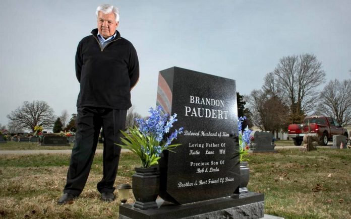 Bob Paudert visits the grave of his son, Sgt. Brandon Paudert, who was gunned down along with another officer in 2010 by a father and son who had been crisscrossing the country preaching about the sovereign citizen movement. Photo by Keith Myers, the Kansas City Star