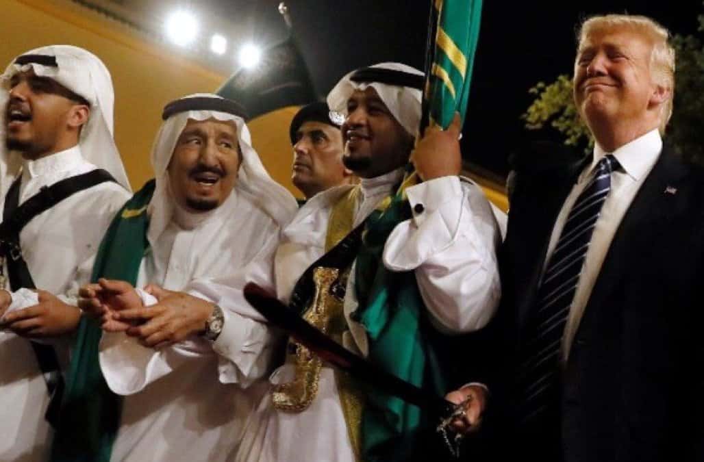 Caption: It is said that the sword dance, originally from Nejd, publicly displays the fighting strength of a tribe before a military engagement.