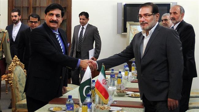 Secretary of Iran’s Supreme National Security Council Ali Shamkhani (R) shakes hands with Adviser to Pakistani Prime Minister on National Security Naseer Khan Janjua in Tehran on July 25, 2016. IRNA