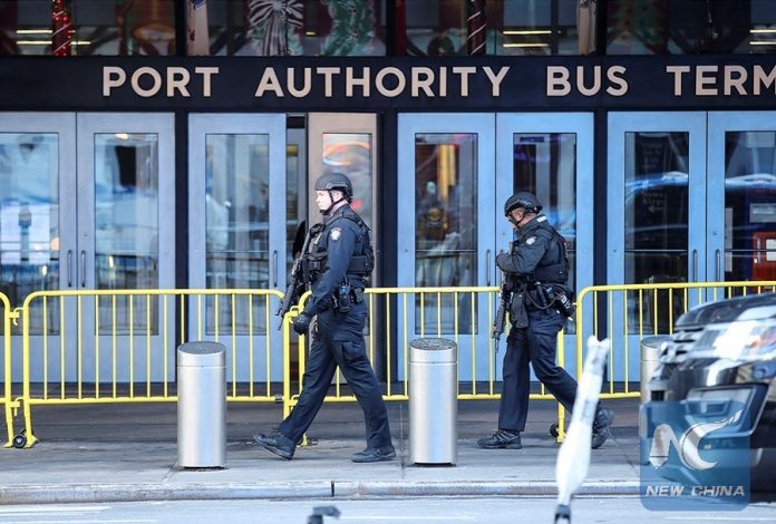 Police officers work near the scene of an explosion in New York City, the United States, on Dec. 11, 2017. Four people were injured in an explosion in a passageway near Times Square, Manhattan in New York City early Monday morning. (Xinhua/Wang Ying)