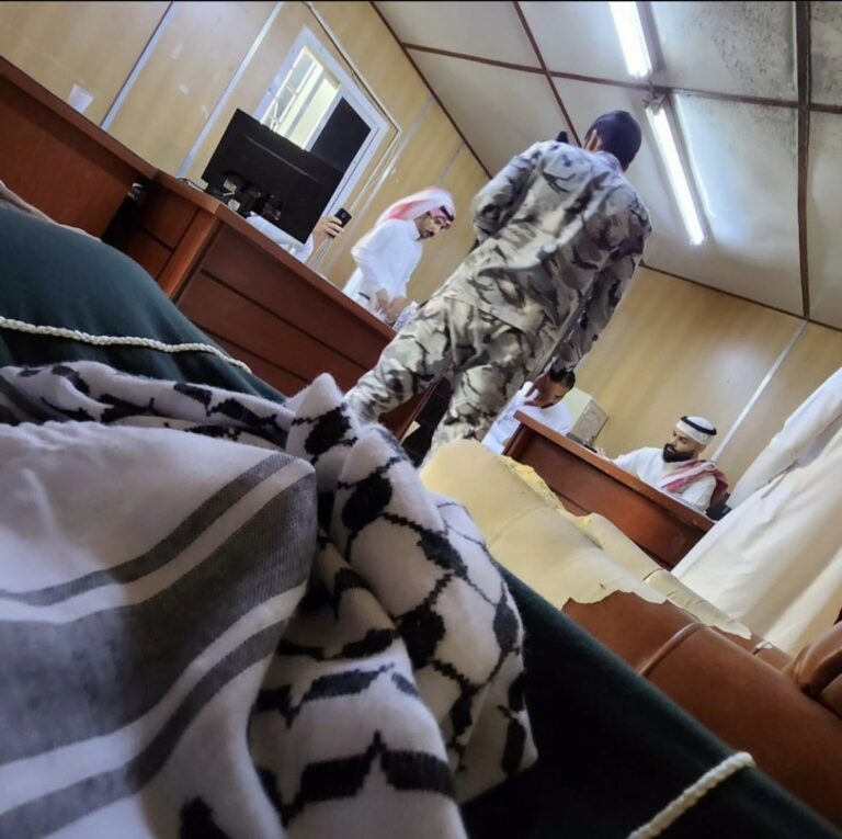Islah Abdur Rahman sits in Saudi detention with a keffiyeh in his lap, via Instagram.