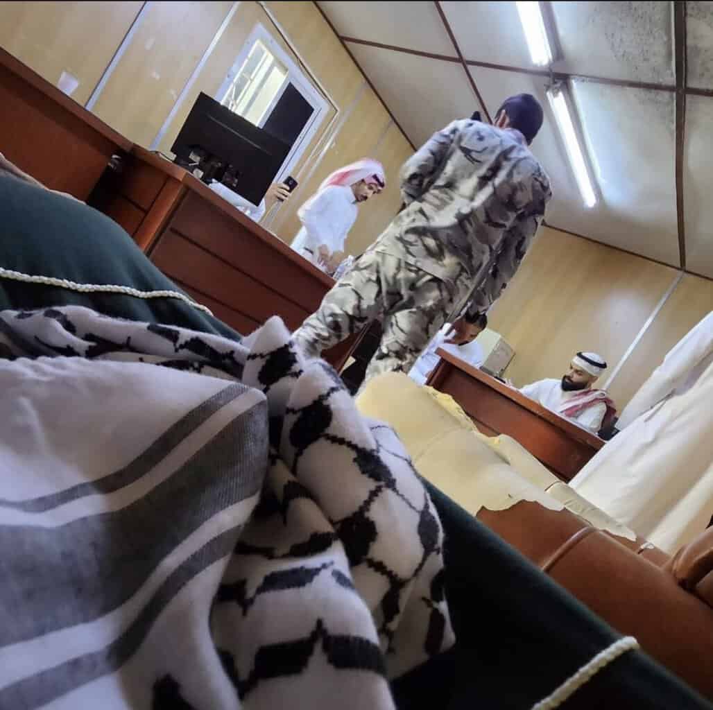 Islah Abdur Rahman sits in Saudi detention with a keffiyeh in his lap, via Instagram.
