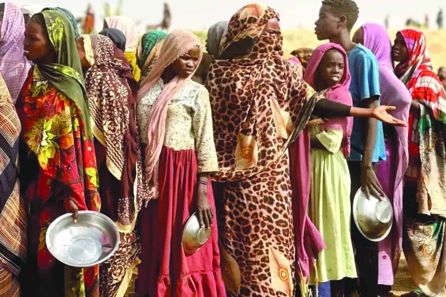 Displaced people of Sudan line up for food distribution. Photo Source:HRW